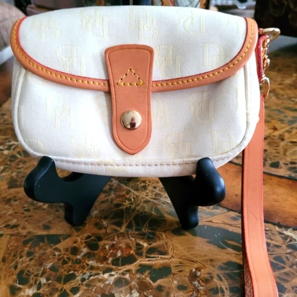 Dooney and Bourke Elegant Cream and Tan Women's pouch - Picture 1 of 4